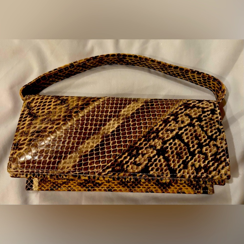 Hand made La Regale Vintage Clutch print snake skin. 
9 inch/ 4 inch/ 2 inch